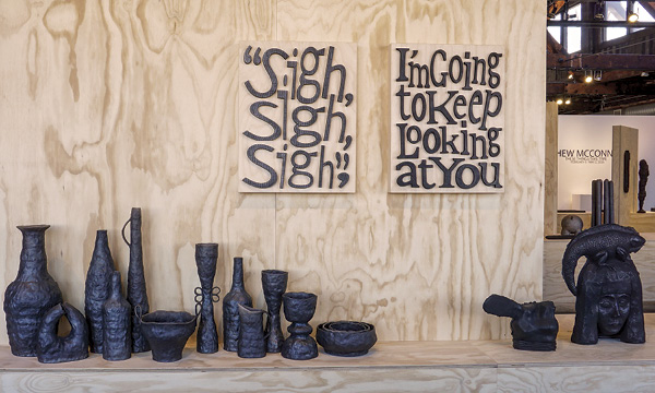 1 (Left to right) Mathew McConnell’s Between One and The Same-Part 4, raku-fired earthenware, 2011; Words Without Work (Sigh, Sigh, Sigh), 21½ in. (54.6 cm) in height, earthenware, bone charcoal, graphite, birch plywood, 2022–2023;