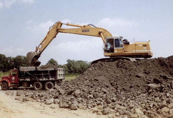 1 Open-pit clay mine showing overburden and upper levels of soil, sand, or gravel and lower levels of clay.