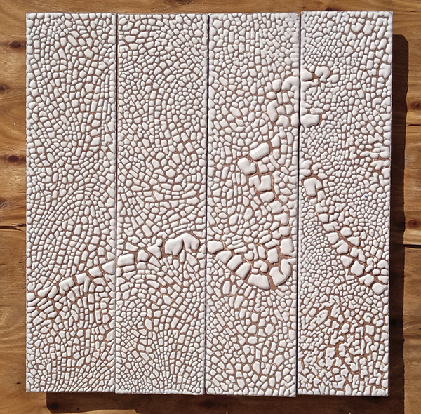 3 Red clay is the foundation of this set of test tiles. Varied application thickness across the four tiles demonstrates the scaling and fired-thickness range of the crawling glaze.