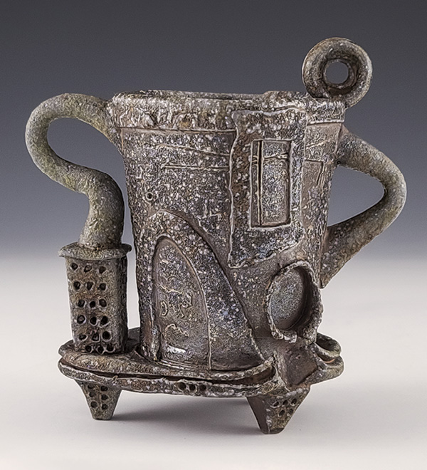 1 Alex Thomure’s coffee mug, 6¼ in. (16 cm) in width, wheel-thrown and altered stoneware with handbuilt elements, laterite slip, soda fired to cone 10–12, reduction cooled, 2023. Photo: Companion Gallery.