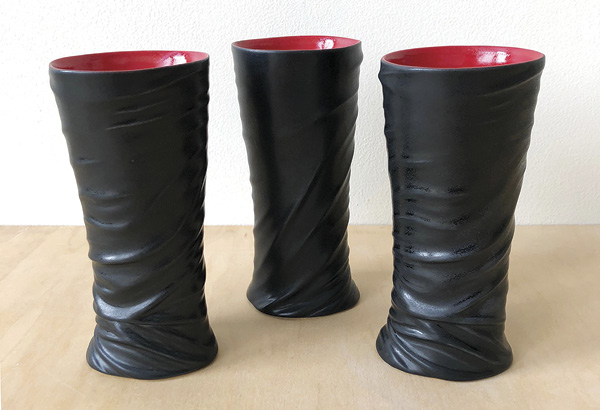 1 Kelsey Duncan’s Black and Red Cups, 7½ in. (19 cm) in height, porcelain.