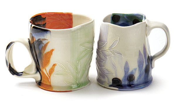 1 Taylor Sijan’s mugs, 4 in. (10.2 cm) in height, wheel-thrown, handbuilt, and slip-trailed mid-range porcelain, slips, underglazes, glazes, fired in oxidation to cone 6. Photo: Silvia Palmer.