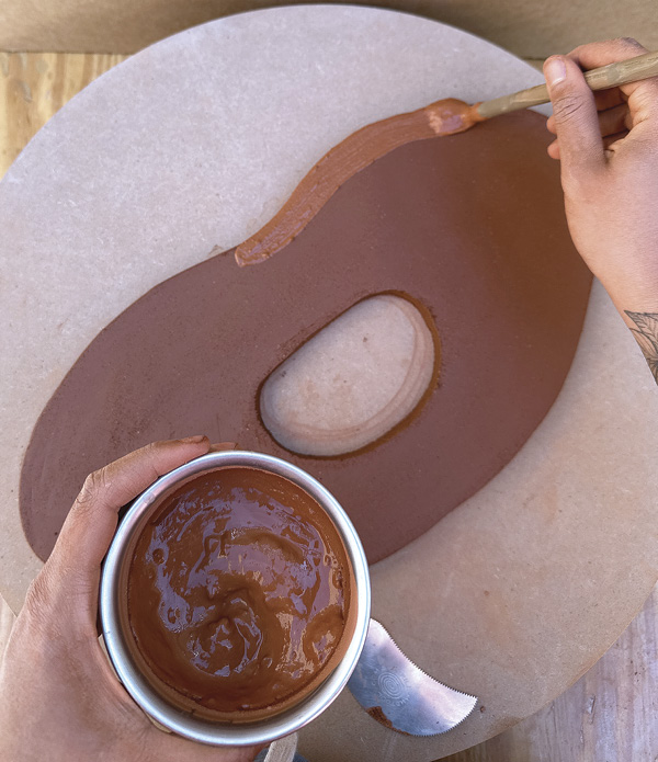 2 Trace and cut the base of the bust and slip and score the oval cylinder in place.