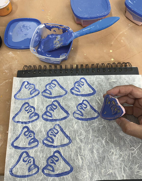 25 Create a unique pattern using rubber stamps and underglaze on rice paper.