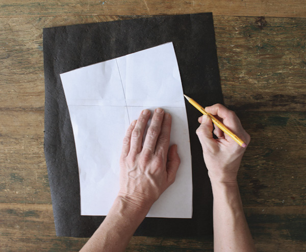 9 Use a pencil or chalk to trace your printer-paper template onto a sheet of tar paper.