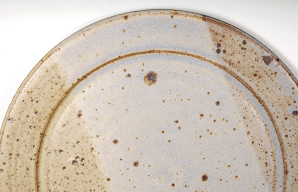 3 Manganese nodules (large brown areas) found in fireclays can result in concave defects, and iron (small brown specks) in the fireclay can result in defects.