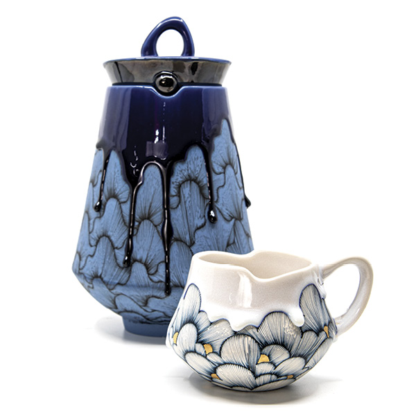 1 Noelle Hoover’s jar and cup, to 9 in. (22.8 cm) in height, slip-cast white stoneware, underglazes, glazes, fired in oxidation to cone 5.