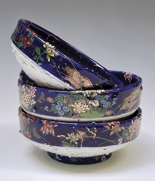 1 Gillian Parke’s teabowls, to 1¾ in. (4.4 cm) in height, wheel-thrown porcelain with feldspar inclusions, fired in reduction to cone 10 in a gas kiln, open-stock decals, metallic luster, fired multiple times to cone 017 in an electric kiln, 2026. Photo: Courtesy of PMA Craft Show.