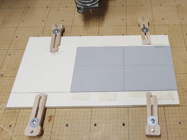 6 Secure wood to the X-Carve table aligned with the grid.