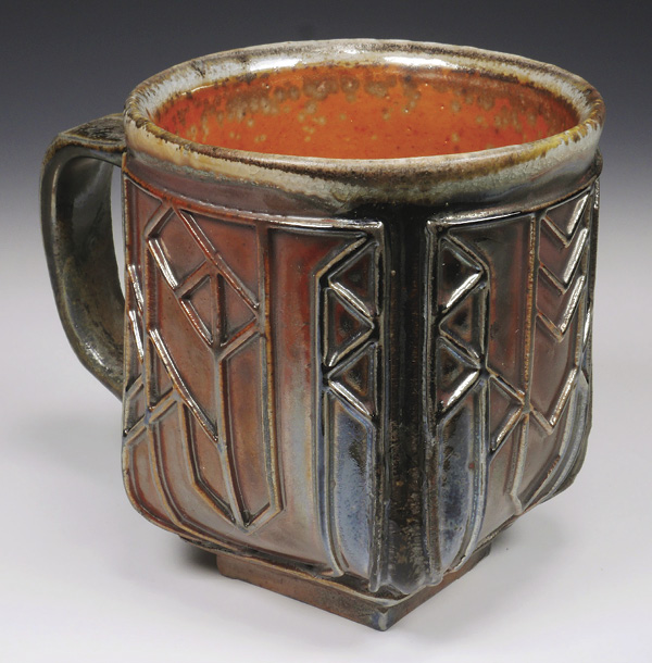 Completed mug with texture mat decoration, stoneware, fired and cooled in reduction in a wood kiln, 2023.