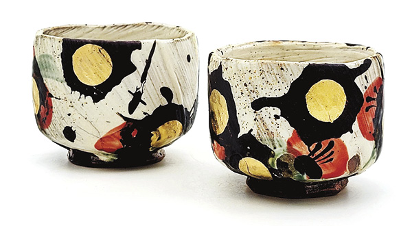 8 Sean O’Connell's Teabowls, 4 in. (10.2 cm) in height (each), handbuilt stoneware, slip, glaze, hand-painted with iron oxide/pigments, fired in reduction to cone 10 in a wood kiln, gold luster, 2024.