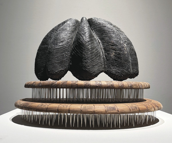 12 Joy Okokon’s Koju Soko ati Afro Comb, 18¼ in. (46.4 cm) in height, stoneware clay, glaze, walnut wood, nails, 2024. Photo: Todd Oberndorfer.