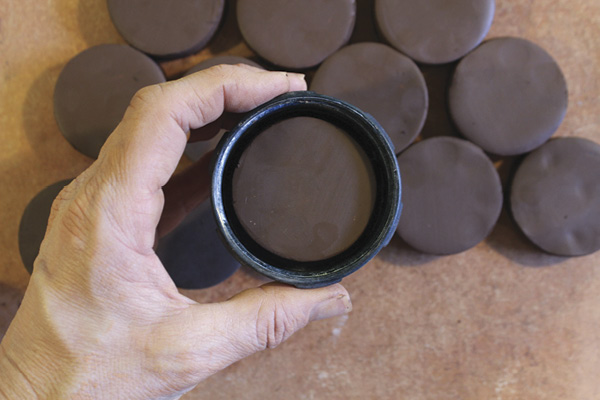3 After cutting your first blank die, double-check that the circle fits into the cap; adjust the diameter of your cutter if needed.