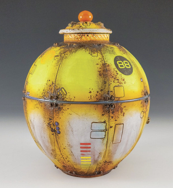 1 Mike Cinelli’s lidded jar, 12 in. (30 cm) in height, wheel-thrown earthenware, sprigs, terra sigillata, underglaze, transfers, copper wash, glaze, fired to cone 04 in an electric kiln, 2022. Photo: Companion Gallery.