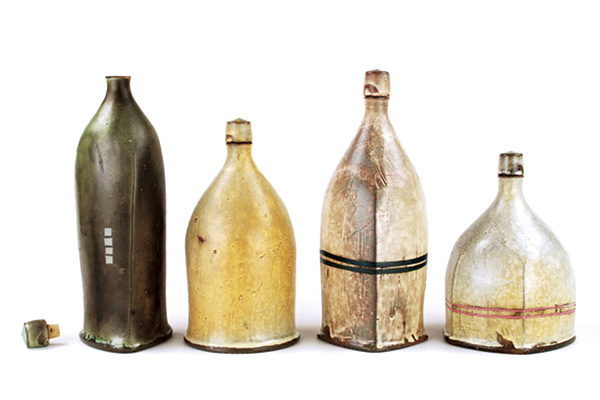 1 Tom Jaszczak’s liquor bottles, to 9 in. (23 cm) in height, wheel-thrown earthenware, various slips applied on leather-hard clay, underglaze, soda fired to cone 2, 2018.