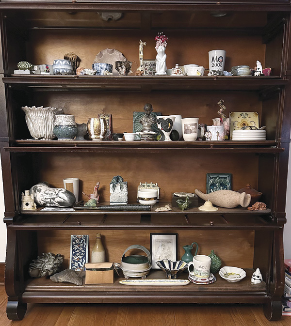 1 Bookcase displaying works by Ehren Tool, Clare Twomey, Andy Brayman, Jessica Brandl, Future Retrieval, Marilyn Lysohir, and more.