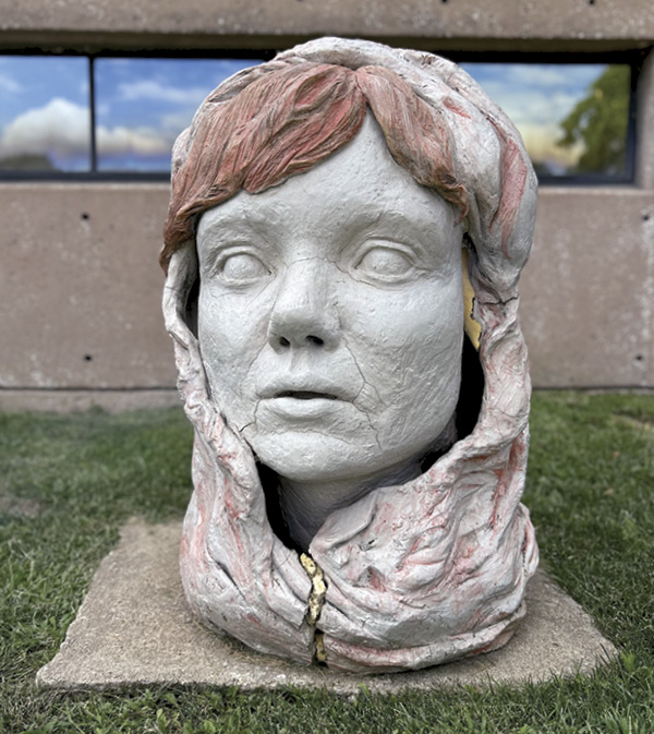 6 Margeaux Claude’s sophomore self-portrait installed on the front lawn of KCAI Ceramics.