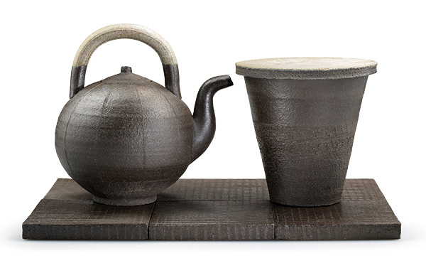 4 Linda Sikora’s Kettle & Frustum Jar on Tile Ground, 21.5 in. (54.6 cm) in length, gritty stoneware, glaze, salt fired, 2024.