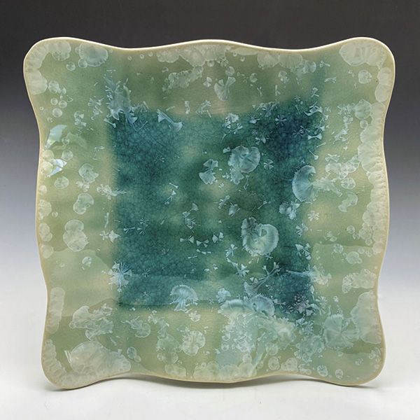 1 Lorraine Colson’s Crystalline Plate, 9 in. (22.9 cm) in diameter, porcelain, crystalline glaze, fired to cone 10, 2024. Photo: Shirley Gromen.