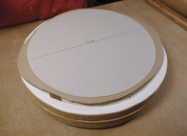 3 Place the slab on a banding wheel and cut it into a circular shape using a template.