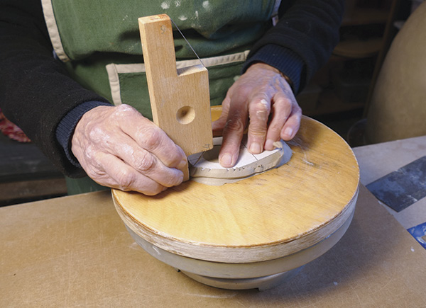 11 Use a bevel cutter to cut the edges of the top piece at an angle.