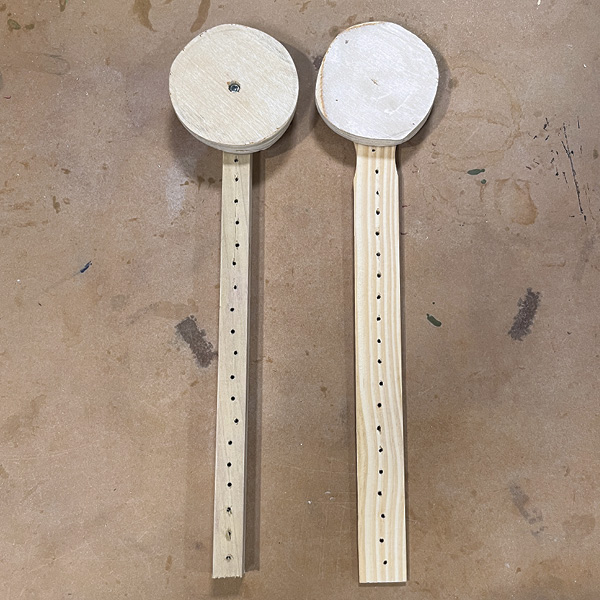 6 Two disk cutters with variations in how the wooden disk is attached to the arm.