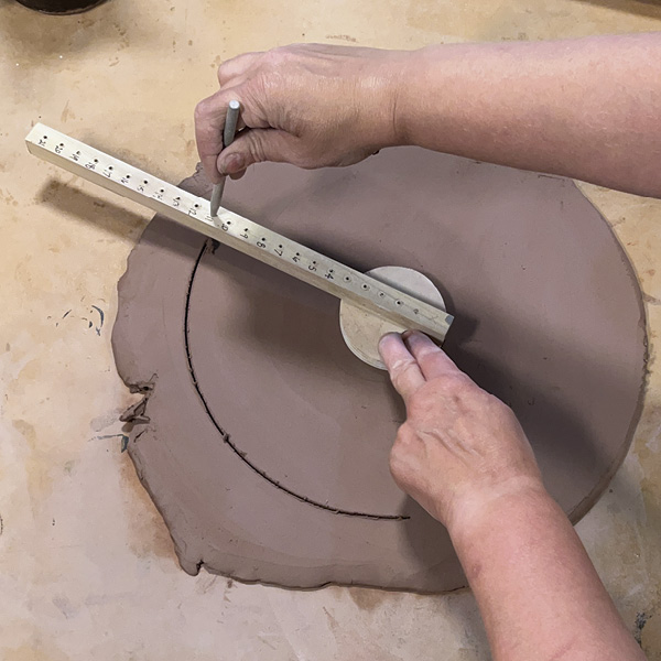 8 Cut out a clay circle using the disk cutter.