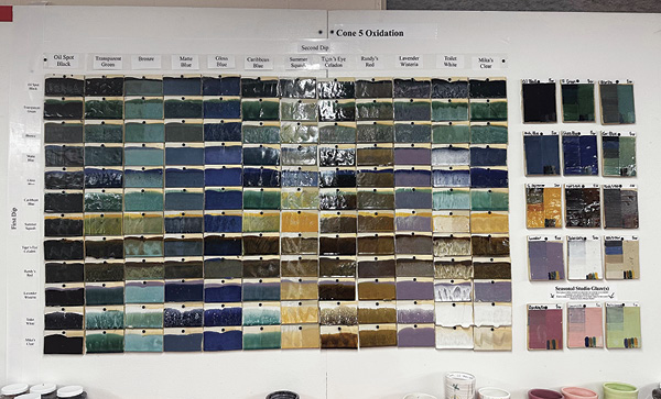 5 Cone-5 Oxidation sample wall showing layering options with two glazes (left); single-glaze tiles showing interactions with colored slips and overglazes (right); and the seasonal cone-10 (reduction) glazes (bottom right).