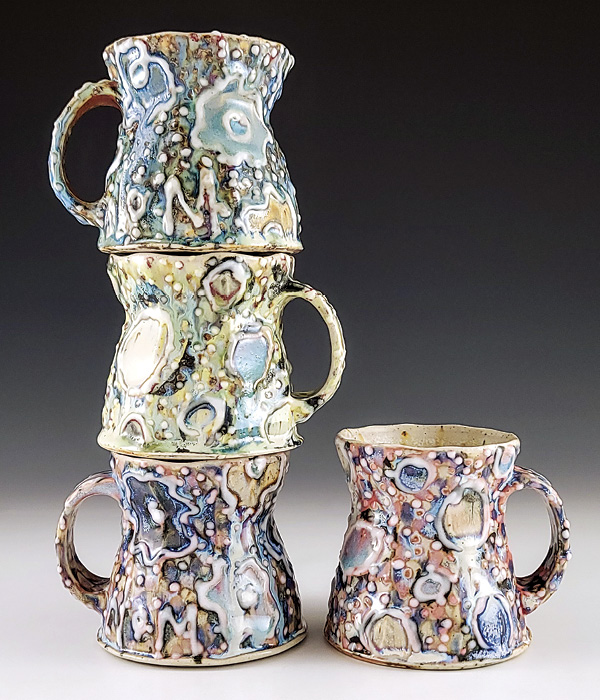 2 NOM Ceramics’ stack of mugs, to 11½ in. (29.2 cm) in height, underglaze, glaze, fired to cone 10 in a soda kiln, 2024.