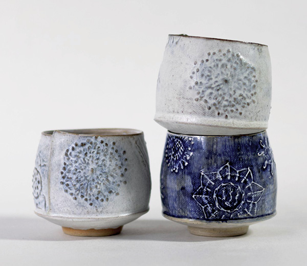 Clare Unger's Yunomi-style tea cups, 3 in. (8 cm) in height (each), Keanes 33 mid-range clay, cobalt and manganese oxides, white underglaze, cobalt wash, mid-range satin matte glaze, mid-range clear glaze, 2025.