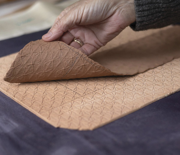 5 Reveal the embossed clay slab.