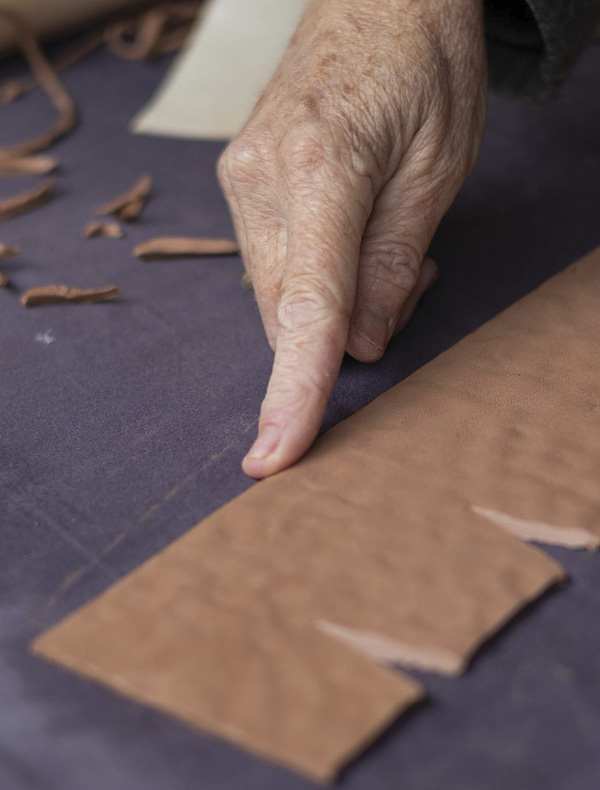 8 Gently bevel the top edge of the slab using your finger. This will be the lip of the cup.