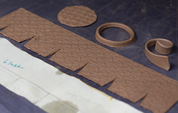 14 Cut a circular slab for the cup base. All the components for making the cup include: the base disk, foot ring, handle, and main slab.