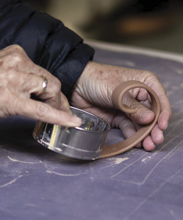 20 Use a cookie cutter to cut a curved, beveled edge at the bottom of the handle.