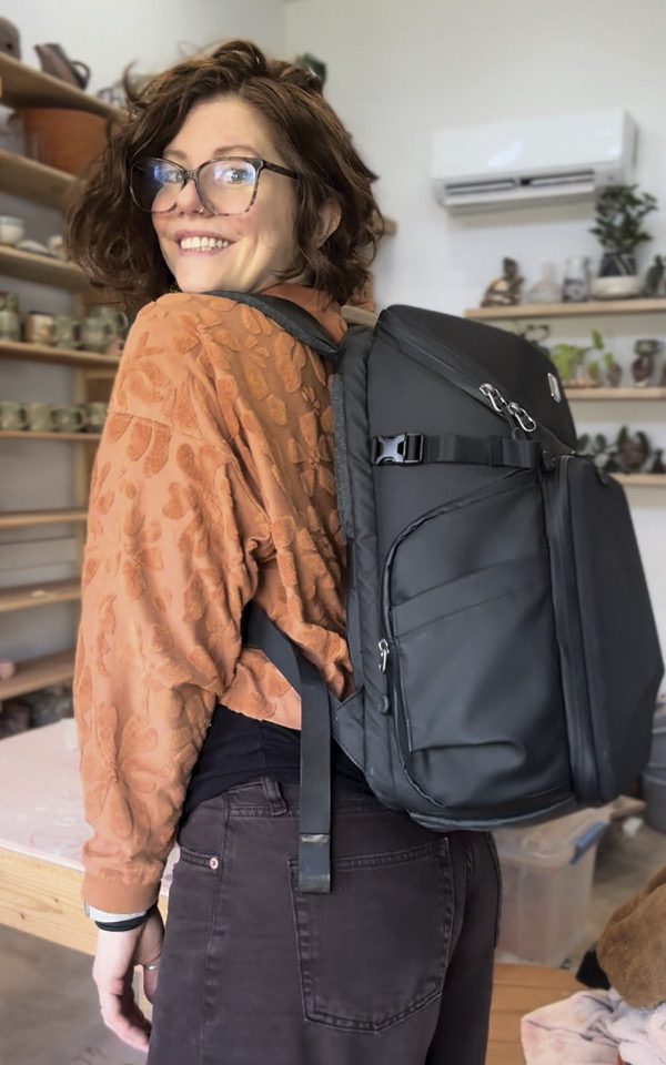 3 Maya Rumsey with her camera backpack, in use.