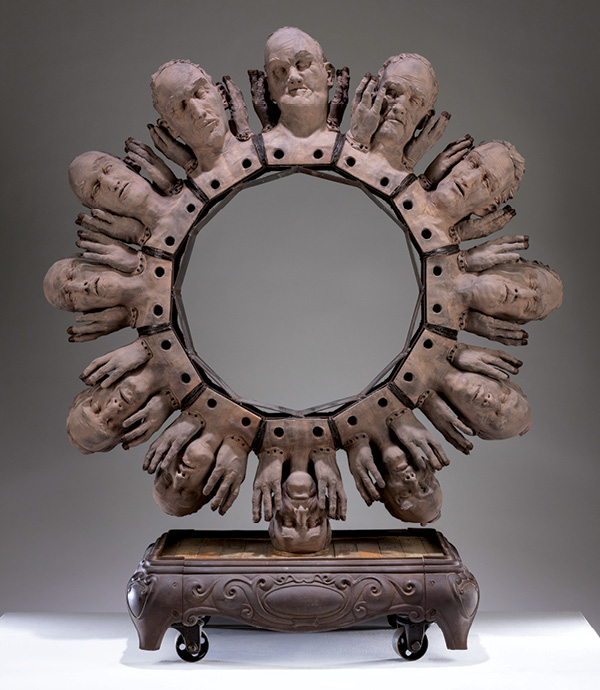 1 Richard W. James' Sisyphean Wheel, 6 ft. (1.8 m) in height, earthenware, underglaze, found objects, steel, epoxy, 2022.