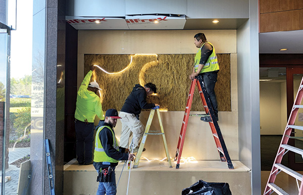 1 To prepare the recessed space, lighting was added by Surl and the installation team.