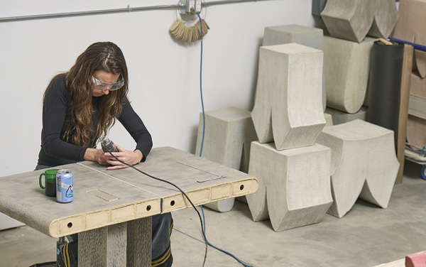 5 Rudolph refining the openings and fit of her table’s mortise and tenon components on a test section. Photo: Andrew Castañeda.