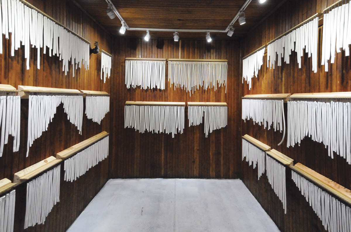 10 Julia Elsas’ Chime Choir (installation at Cooler Gallery), 8 ft. (2.4 m) in width, porcelain, fired to cone 6 in oxidation, linen, wood, 2020. Photo: Michael Yarinsky.