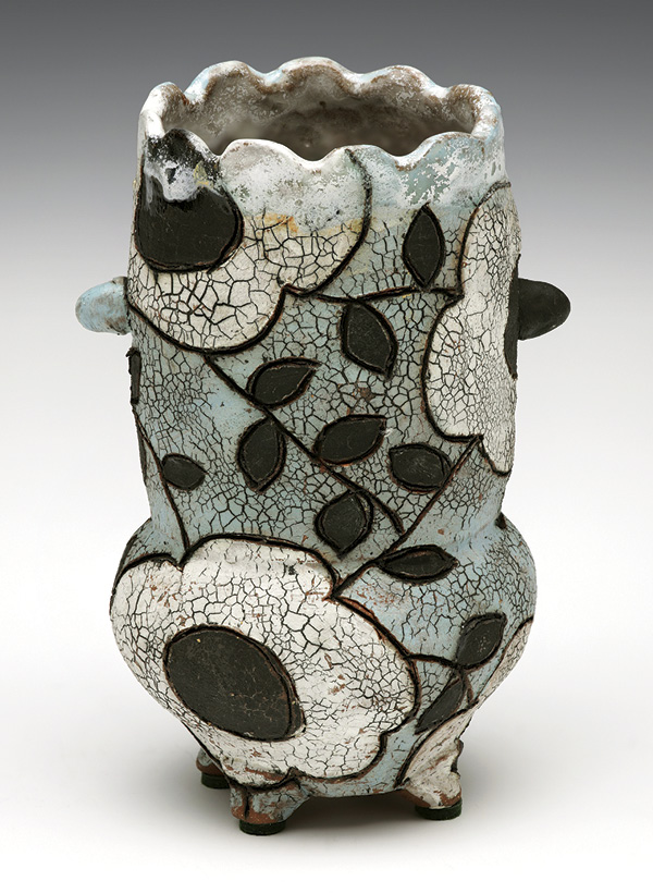 22 Scot Cameron-Bell’s Vase with Attitude, 9 in. (23 cm) in height, wheel-thrown and altered clay, underglaze colors, wax, sgraffito, oxide wash, fired to cone 5, 2023. Photo: Harold Oxley.