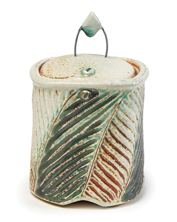 1 Joy Tanner’s lidded jar, 11 in. (27.9 cm) in height, wheel-thrown and altered high-fire stoneware, slips, glazes, fired to cone 10 in a soda kiln.