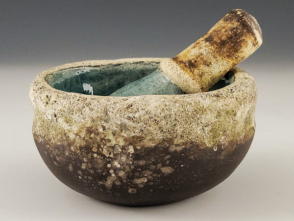 5 Alejandra Almuelle’s mortar and pestle, to 5.3 in. (13.3 cm) in length, stoneware and porcelain double bowl, fired to cone 5, 2024.