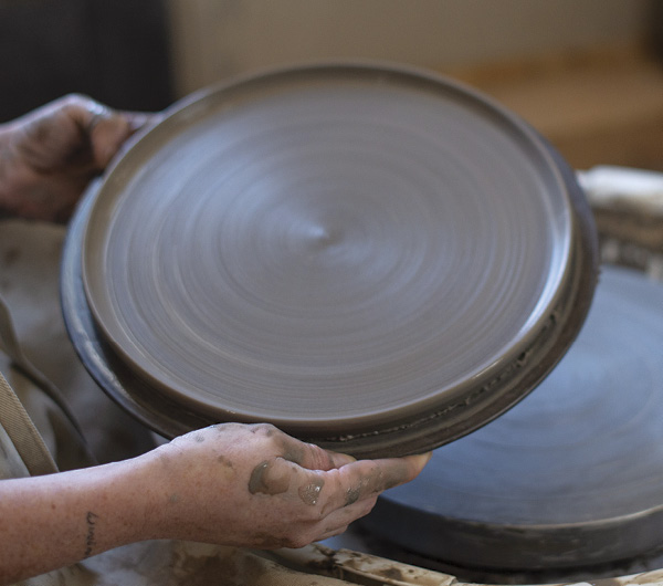 3 Once compressed and to the desired diameter, pull the outer edge to form the plate’s rim.