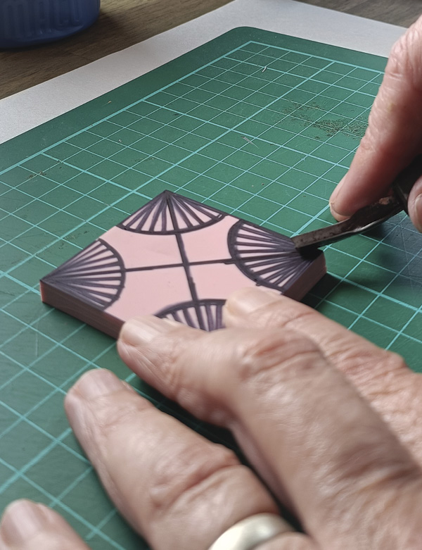 7 Using Speedy-Carve block and a V-shaped lino-cutting gouge, start cutting your design into the stamp. Remember to always cut away from yourself.