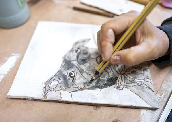 1 Underglaze was painted onto each tile after etching in the image.