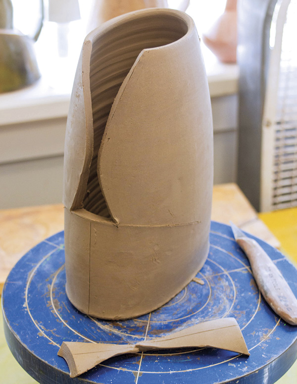 5 After removing darts, cut horizontally at the base of the cutout area to allow the cut wings to move.