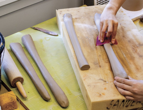 16 Roll out 14-inch (35.6-cm) coils of varying widths and then pull each to refine the taper, width, and profile of each handle.