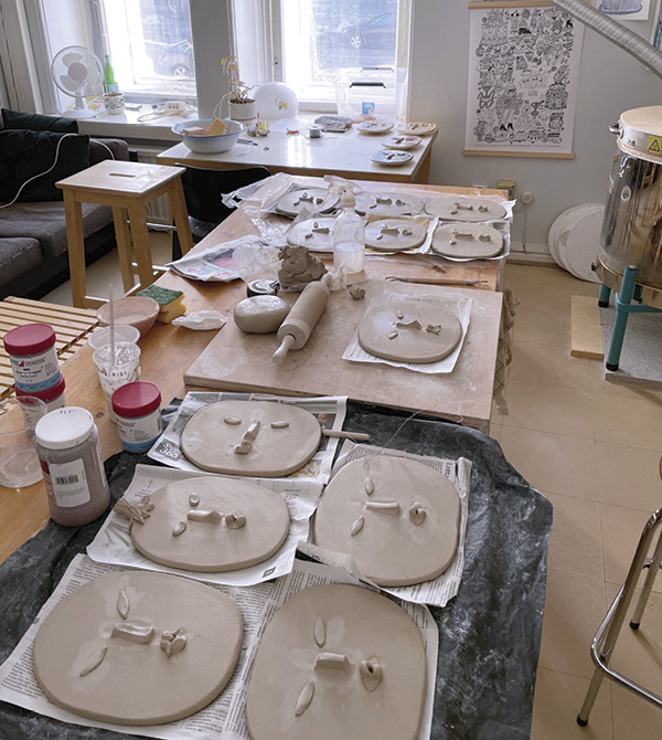 1 Over a dozen face reliefs in progress cover the worktables in Teva’s Aleksanteri’s Theater studio, Helsinki.