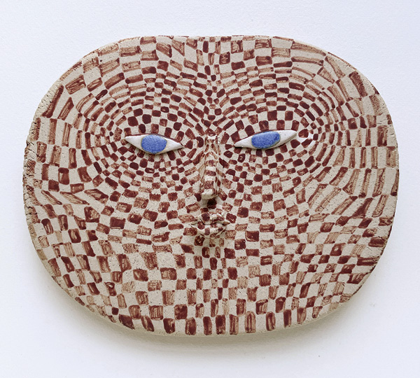 3 Face relief from the Slow, silly, go! series, 7⅞ in. (20 cm) in diameter, stoneware, stained slips, 2024.