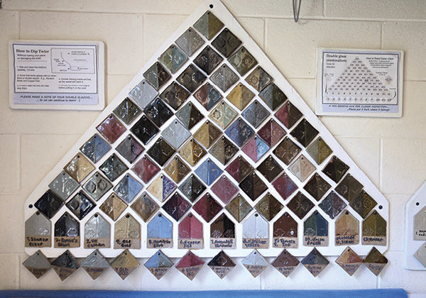2 The tile pyramid is mounted near the twelve studio glaze buckets, with the individual combination tiles made removable for closer inspection.